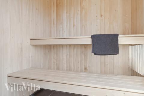 Genießen Sie die heiße Sauna im Luxusferienhaus Nr. 906 für 18 Personen