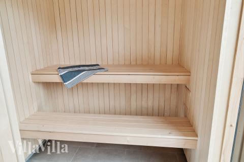 Genießen Sie die heiße Sauna im Luxusferienhaus Nr. 697 für 20 Personen