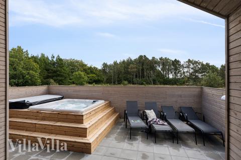 Genießen Sie den warmen Whirlpool im Luxusferienhaus Nr. 699 in Nordjütland