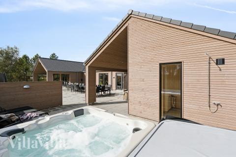 Das Luxusferienhaus Nr. 699 bietet u. a. einen tollen Whirlpool