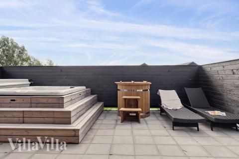 Genießen Sie den warmen Whirlpool im Luxusferienhaus Nr. 655 in Fünen und seine Inseln