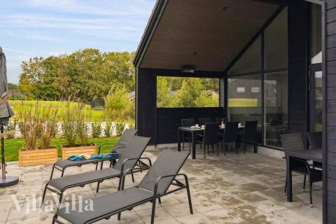 Genießen Sie einen Grillabend auf der Terrasse des Luxusferienhauses Nr. 664 in Südjütland