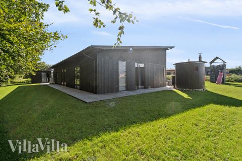 Diese schicke Haus mit Whirlpool Nr. 925 mit Platz für 12 Personen liegt in Limfjord