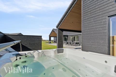 Genießen Sie den warmen Whirlpool im Luxusferienhaus Nr. 673 in Fünen und seine Inseln