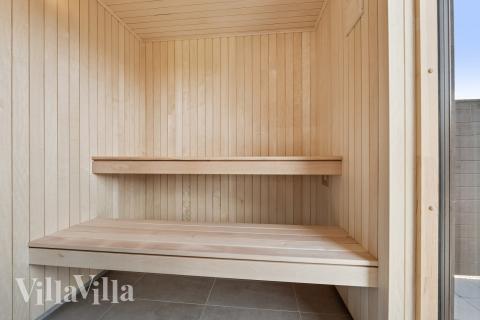 Genießen Sie die heiße Sauna im Luxusferienhaus Nr. 698 für 14 Personen