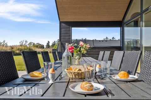 Genießen Sie einen Grillabend auf der Terrasse des Luxusferienhauses Nr. 617 in Fünen und seine Inseln