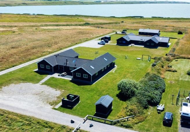 Dieses schöne Poolhaus Nr. 293 mit Platz für 22 Personen liegt in Westjütland