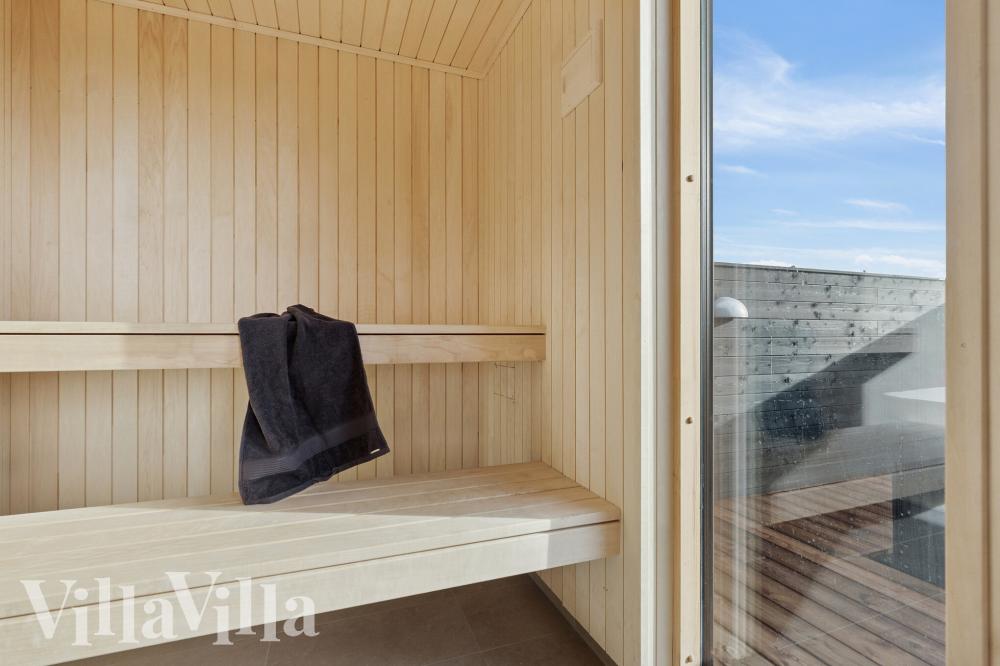 Genießen Sie die heiße Sauna im Luxusferienhaus Nr. 902 für 18 Personen