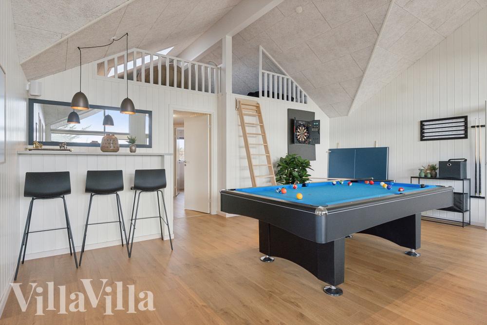 Neben den vielen schönen Stunden, die man im Poolbereich des Hauses verbringen kann, bietet das Luxusferienhaus 902 auch Spielevergnügen bei Billard/Tischtennis und Darts