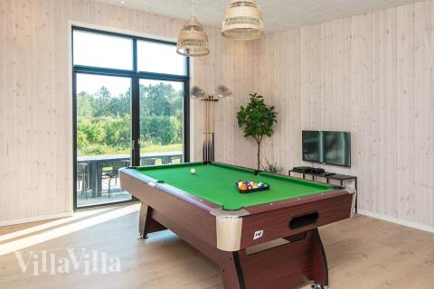 Neben den vielen schönen Stunden, die man im Poolbereich des Hauses verbringen kann, bietet das Luxusferienhaus 938 auch Spielevergnügen bei Billard/Tischtennis und Darts