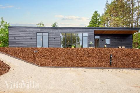 Diese schicke Haus mit Whirlpool Nr. 939 mit Platz für 16 Personen liegt in Ostjütland