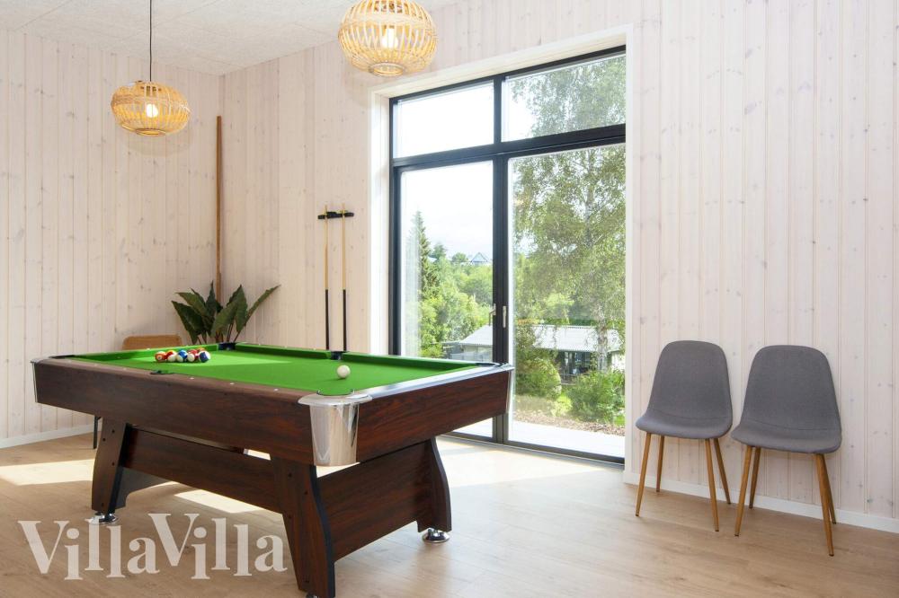Das Luxusferienhaus 939 für 16 Personen hat einen großen Aktivitätsraum mit u. a. Billard und Darts