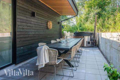 Genießen Sie einen Grillabend auf der Terrasse des Luxusferienhauses Nr. 939 in Ostjütland
