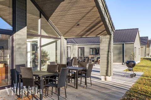 Genießen Sie einen Grillabend auf der Terrasse des Luxusferienhauses Nr. 806 in Ostjütland