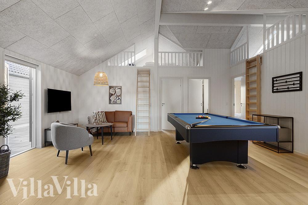 Neben den vielen schönen Stunden, die man im Poolbereich des Hauses verbringen kann, bietet das Luxusferienhaus 802 auch Spielevergnügen bei Billard/Tischtennis und Darts