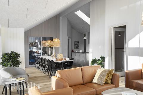 Die Couch im Luxusferienhaus Nr. 802 in Ostjütland lädt zu Gesellschaftsspielen oder zu Kinoabenden ein.