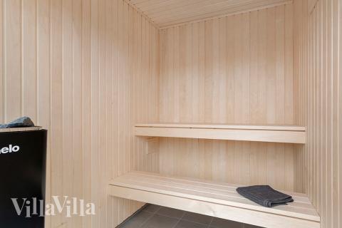 Genießen Sie die heiße Sauna im Luxusferienhaus Nr. 900 für 18 Personen