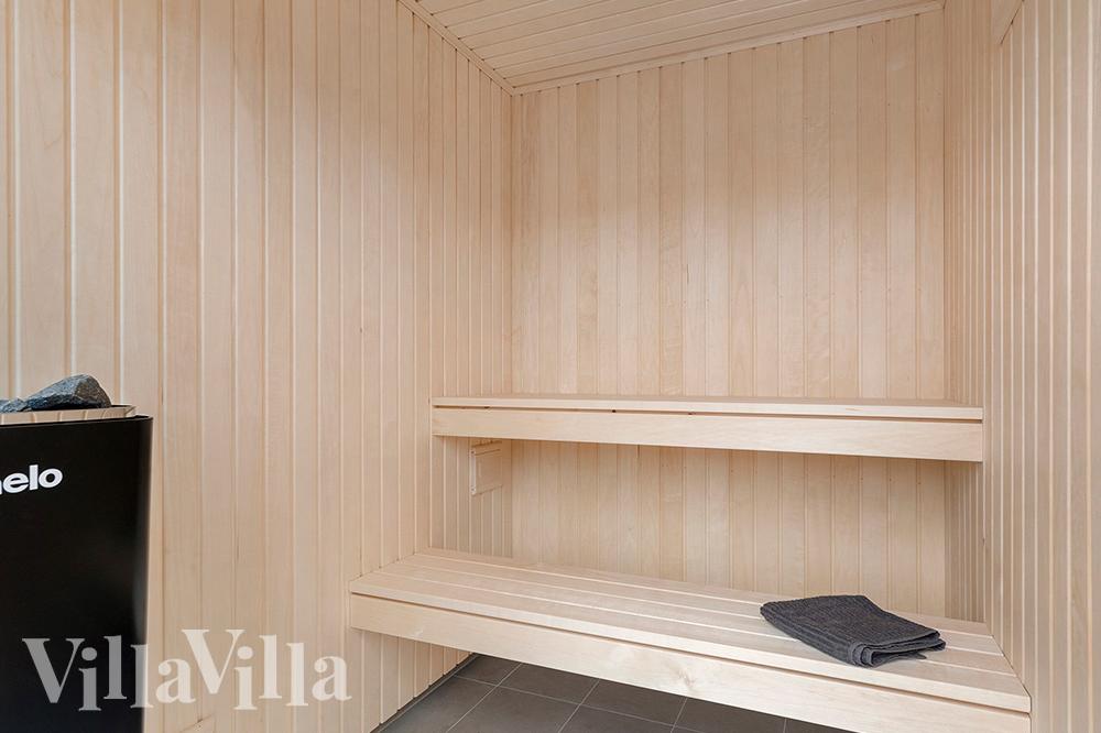 Genießen Sie die heiße Sauna im Luxusferienhaus Nr. 900 für 18 Personen