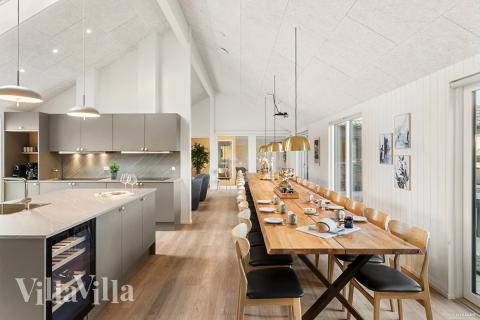 Aufenthaltsraum mit Platz für 30 im Luxusferienhaus Nr. 910.