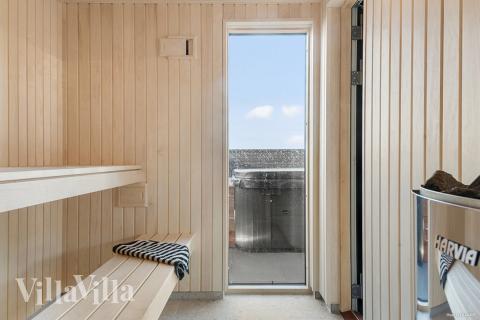 Genießen Sie die heiße Sauna im Luxusferienhaus Nr. 910 für 30 Personen