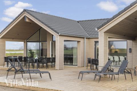 Genießen Sie einen Grillabend auf der Terrasse des Luxusferienhauses Nr. 906 in Fünen und seine Inseln