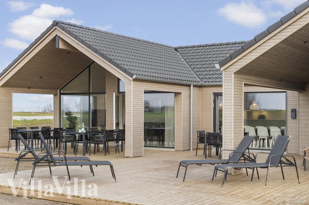 Genießen Sie einen Grillabend auf der Terrasse des Luxusferienhauses Nr. 906 in Fünen und seine Inseln