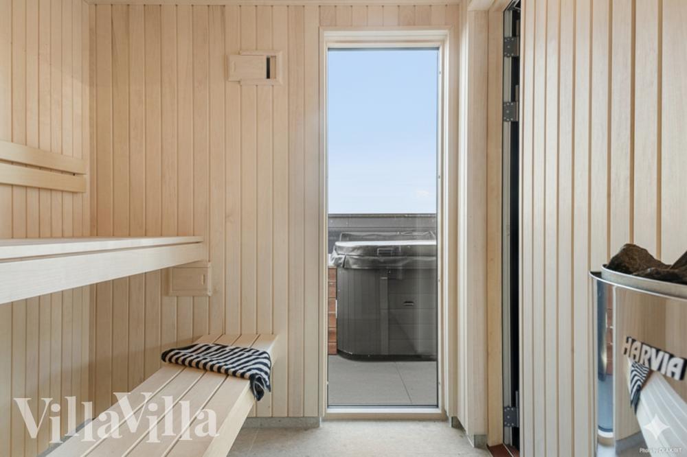 Genießen Sie die heiße Sauna im Luxusferienhaus Nr. 910 für 30 Personen
