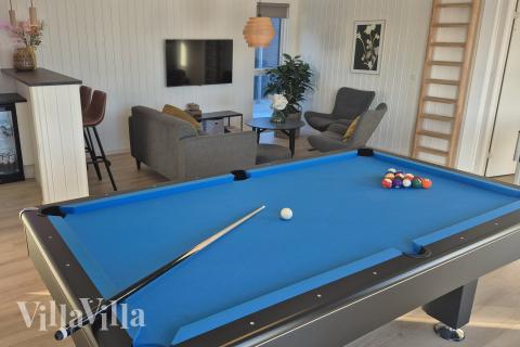 Neben den vielen schönen Stunden, die man im Poolbereich des Hauses verbringen kann, bietet das Luxusferienhaus 668 auch Spielevergnügen bei Billard/Tischtennis und Darts