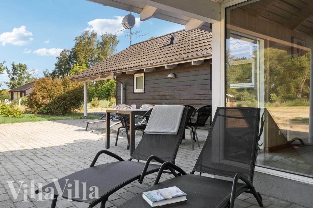Genießen Sie einen Grillabend auf der Terrasse des Luxusferienhauses Nr. 159 in Lolland/Falster/Mön