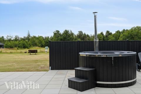 Genießen Sie den warmen Whirlpool im Luxusferienhaus Nr. 942 in Fünen und seine Inseln
