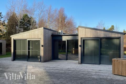 Genießen Sie einen Grillabend auf der Terrasse des Luxusferienhauses Nr. 924 in Lolland/Falster/Mön