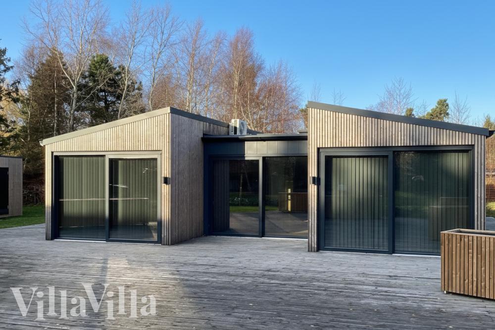 Genießen Sie einen Grillabend auf der Terrasse des Luxusferienhauses Nr. 924 in Lolland/Falster/Mön