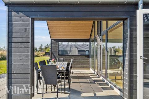 Genießen Sie einen Grillabend auf der Terrasse des Luxusferienhauses Nr. 928 in Westjütland