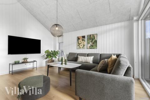 Die Couch im Luxusferienhaus Nr. 810 in Ostjütland lädt zu Gesellschaftsspielen oder zu Kinoabenden ein.