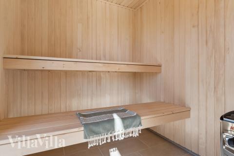 Genießen Sie die heiße Sauna im Luxusferienhaus Nr. 930 für 14 Personen