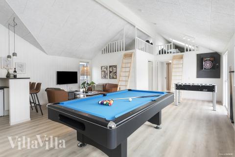 Neben den vielen schönen Stunden, die man im Poolbereich des Hauses verbringen kann, bietet das Luxusferienhaus 912 auch Spielevergnügen bei Billard/Tischtennis und Darts