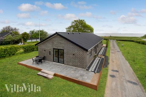 Diese schicke Haus mit Whirlpool Nr. 950 mit Platz für 9 Personen liegt in Fünen und seine Inseln