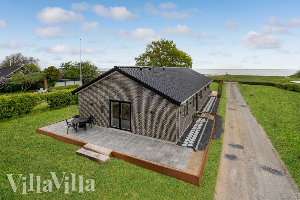 Diese schicke Haus mit Whirlpool Nr. 950 mit Platz für 9 Personen liegt in Fünen und seine Inseln