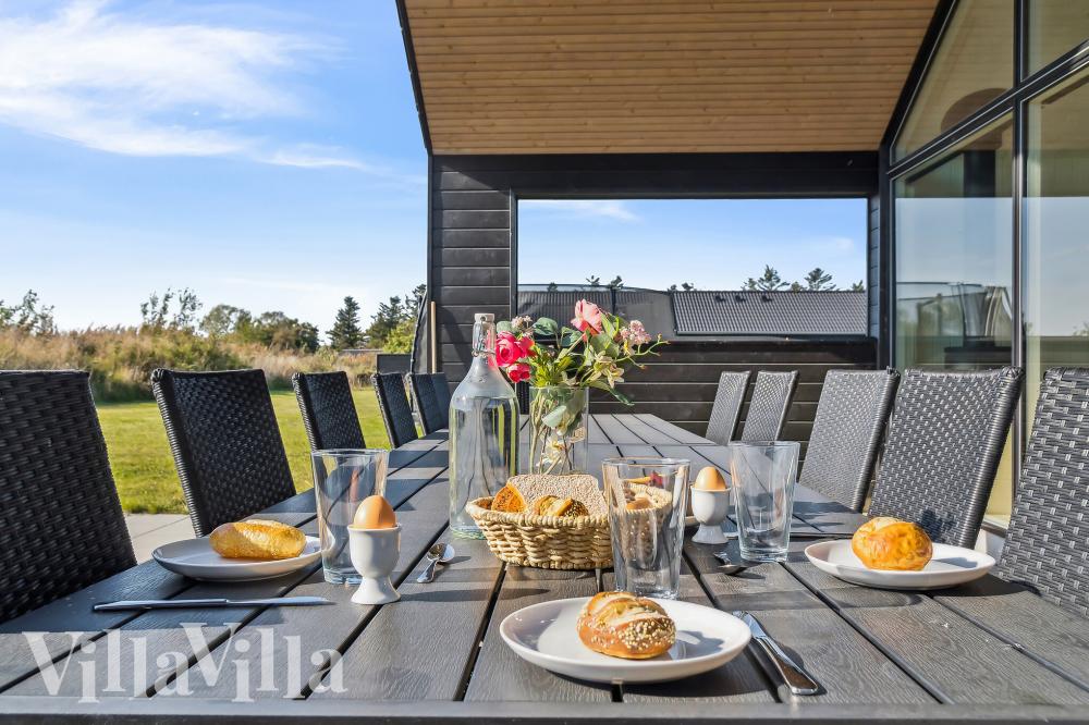 Genießen Sie einen Grillabend auf der Terrasse des Luxusferienhauses Nr. 775 in Deutschland