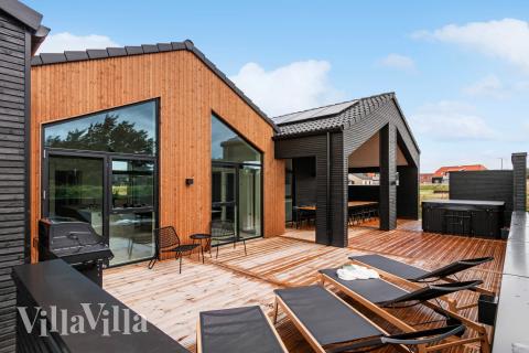 Genießen Sie einen Grillabend auf der Terrasse des Luxusferienhauses Nr. 682 in Nordjütland