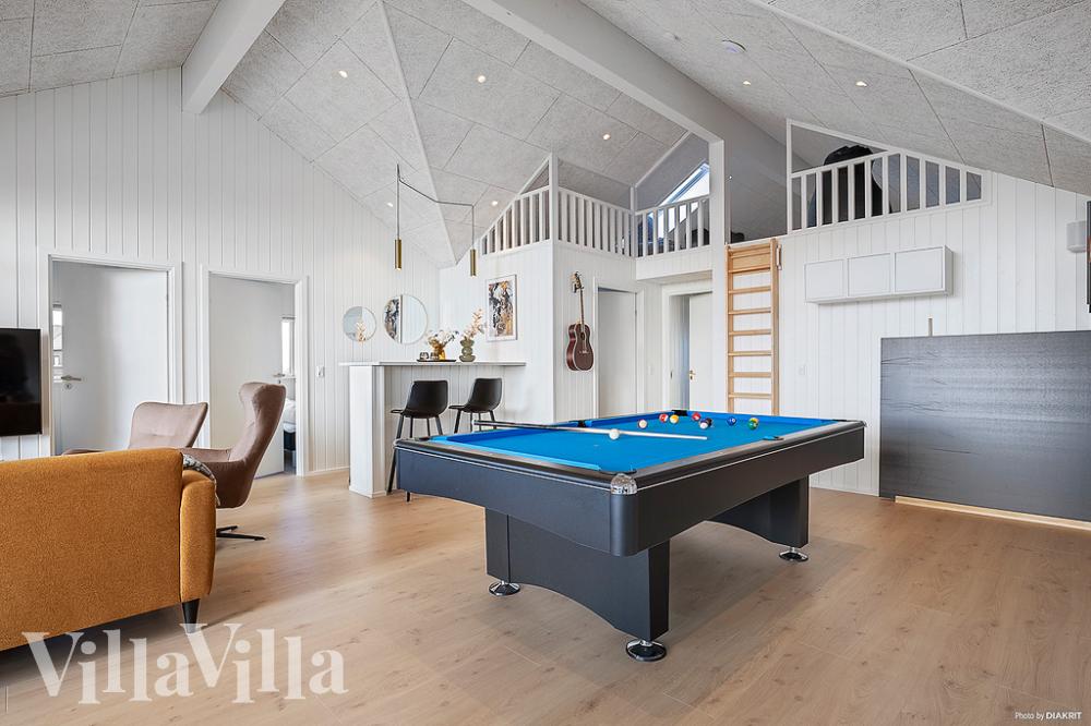 Neben den vielen schönen Stunden, die man im Poolbereich des Hauses verbringen kann, bietet das Luxusferienhaus 948 auch Spielevergnügen bei Billard/Tischtennis und Darts