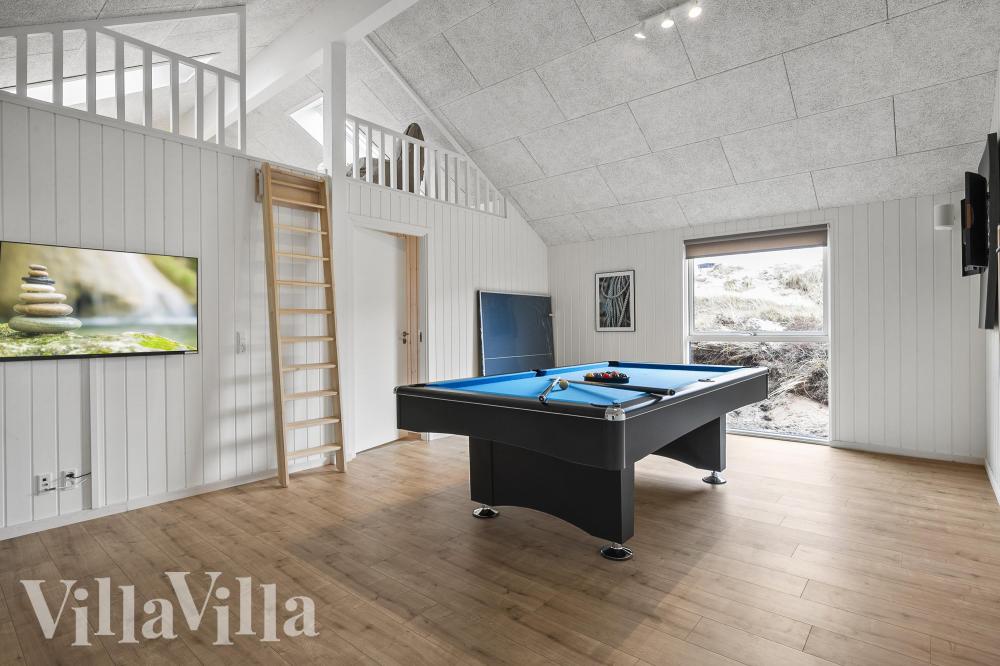 Das Luxusferienhaus 928 für 14 Personen hat einen großen Aktivitätsraum mit u. a. Billard und Darts