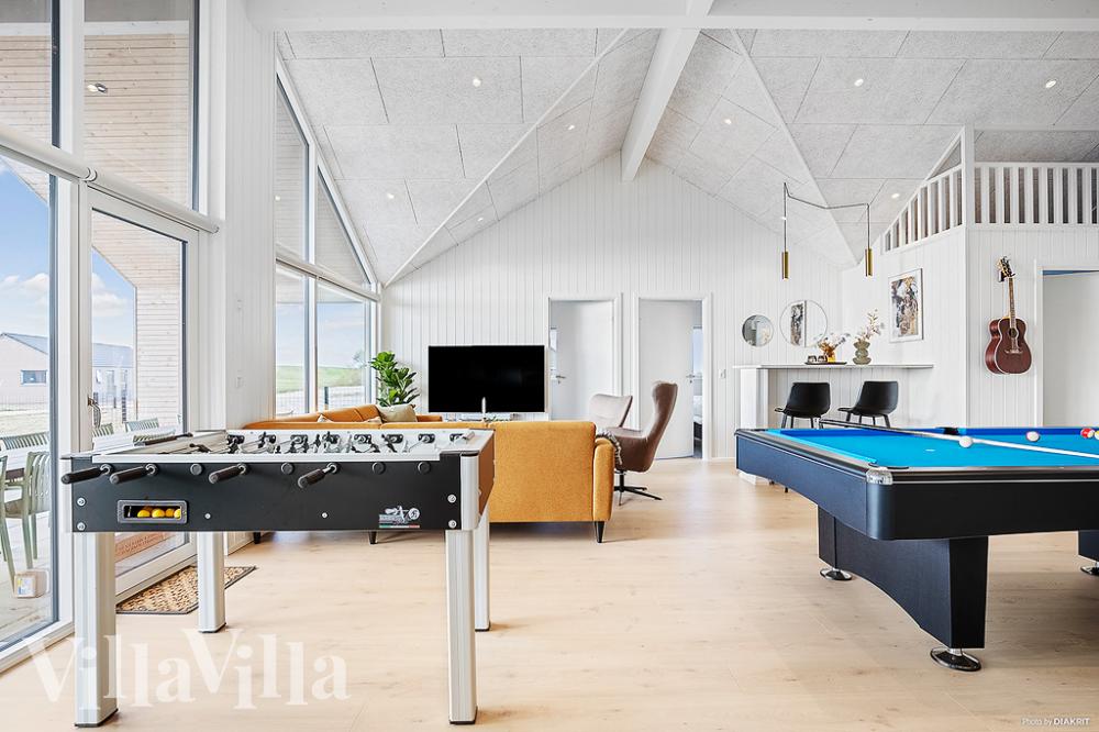 Neben den vielen schönen Stunden, die man im Poolbereich des Hauses verbringen kann, bietet das Luxusferienhaus 959 auch Spielevergnügen bei Billard/Tischtennis und Darts