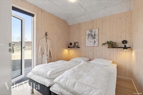 Eines der 12 Schlafzimmer im Luxusferienhaus Nr. 822