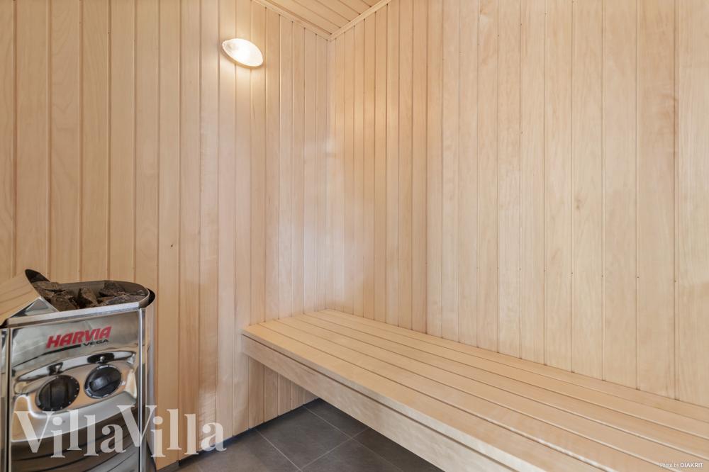 Genießen Sie die heiße Sauna im Luxusferienhaus Nr. 822 für 30 Personen