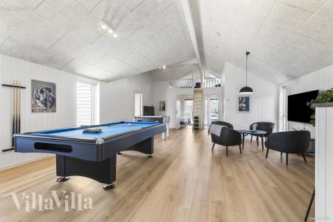 Neben den vielen schönen Stunden, die man im Poolbereich des Hauses verbringen kann, bietet das Luxusferienhaus 824 auch Spielevergnügen bei Billard/Tischtennis und Darts