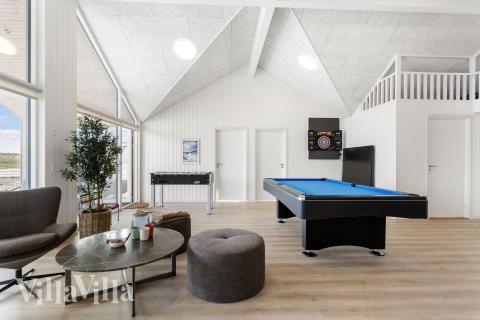 Neben den vielen schönen Stunden, die man im Poolbereich des Hauses verbringen kann, bietet das Luxusferienhaus 917 auch Spielevergnügen bei Billard/Tischtennis und Darts
