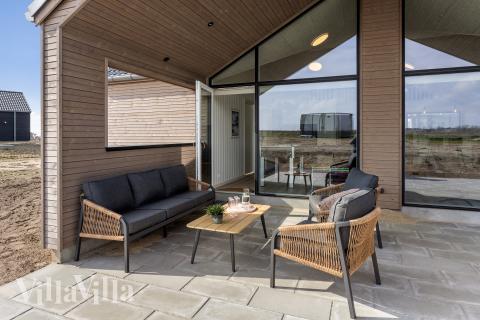 Genießen Sie einen Grillabend auf der Terrasse des Luxusferienhauses Nr. 917 in Fünen und seine Inseln