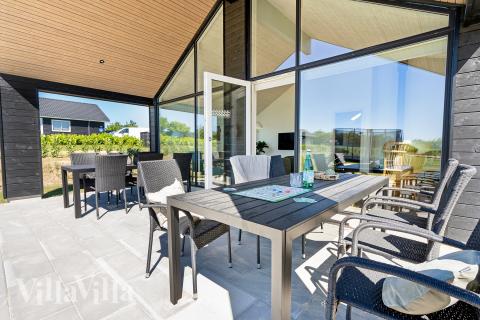 Genießen Sie einen Grillabend auf der Terrasse des Luxusferienhauses Nr. 957 in Fünen und seine Inseln