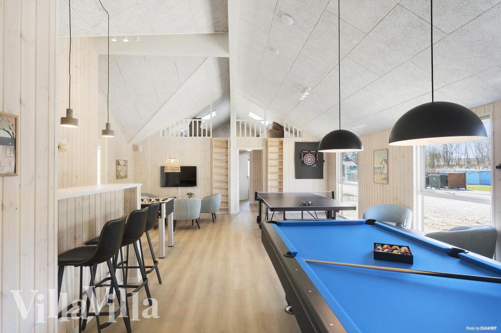 Neben den vielen schönen Stunden, die man im Poolbereich des Hauses verbringen kann, bietet das Luxusferienhaus 933 auch Spielevergnügen bei Billard/Tischtennis und Darts